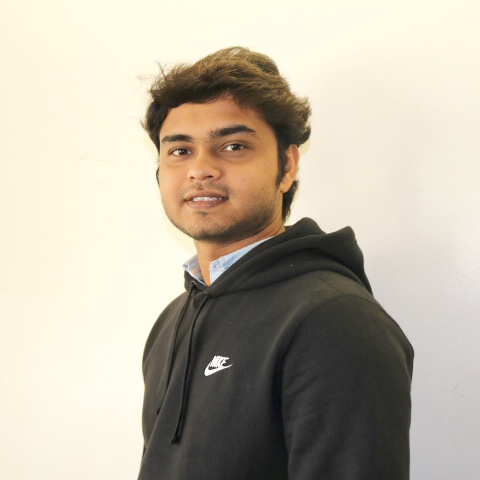 Shubham Patel smiling in a black nike sweatshirt